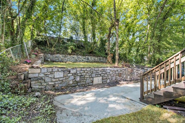 fenced backyard with a patio area