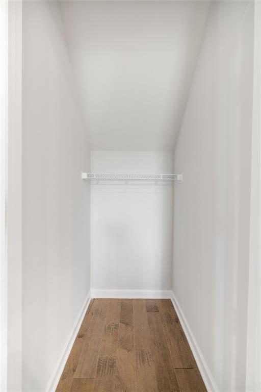 spacious closet featuring hardwood / wood-style floors