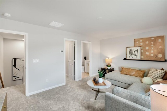 living room featuring light carpet