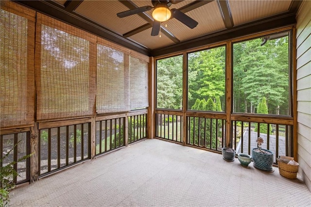 unfurnished sunroom with ceiling fan and coffered ceiling