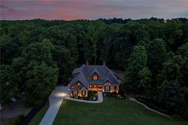 view of subject property featuring a forest