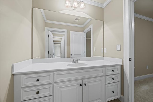 bathroom featuring crown molding, vanity, and baseboards