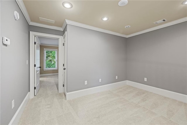 unfurnished room featuring carpet, crown molding, recessed lighting, baseboards, and a smoke detector