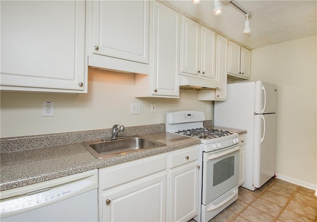 kitchen featuring white cabinetry, sink, white appliances, and light tile patterned floors