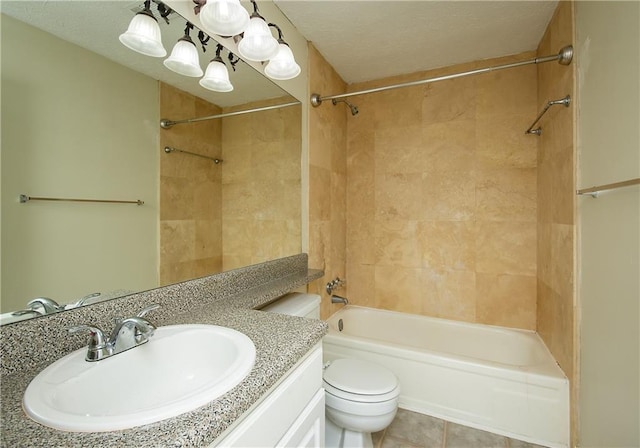 full bathroom with vanity, toilet, tiled shower / bath, and tile patterned flooring