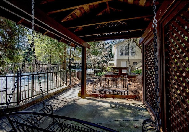 wooden terrace with a patio area