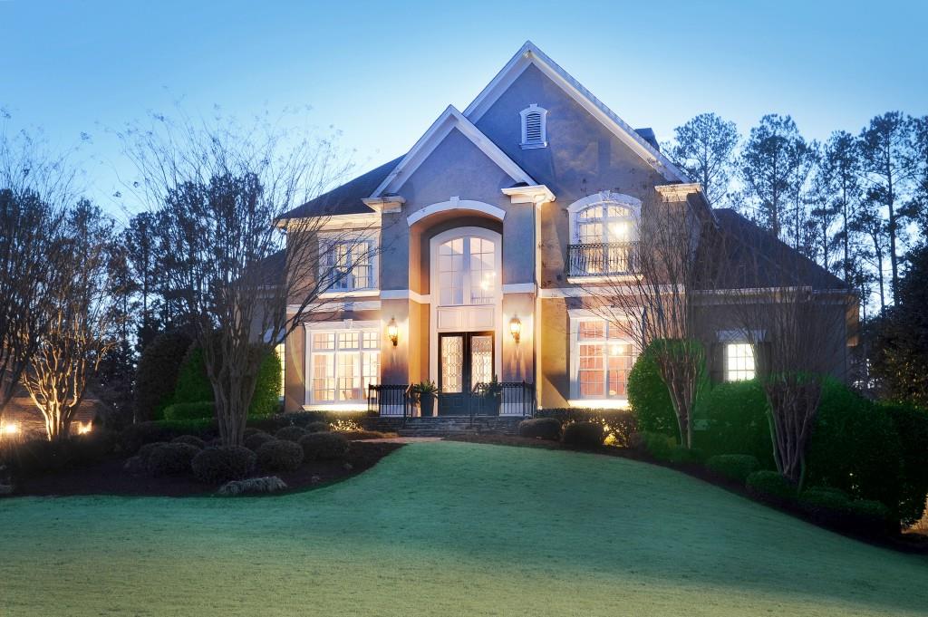 view of front of home with a yard and french doors