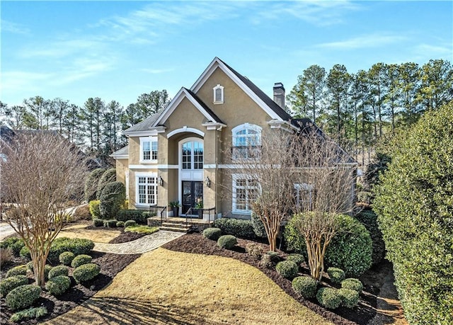 front facade featuring french doors