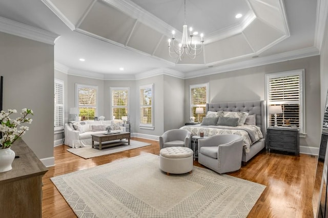 bedroom featuring an inviting chandelier, ornamental molding, and hardwood / wood-style floors