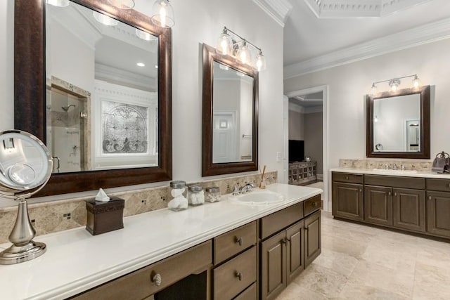 bathroom featuring vanity, crown molding, a shower with door, and decorative backsplash