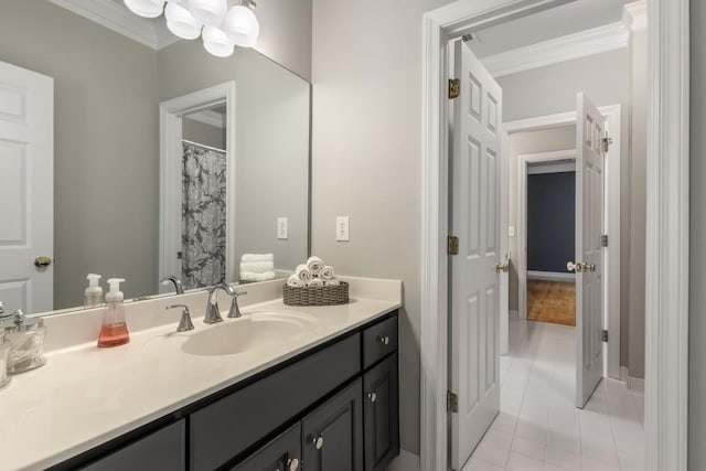 bathroom featuring vanity, tile patterned flooring, and crown molding