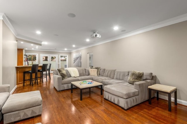 living room with dark wood-type flooring and ornamental molding