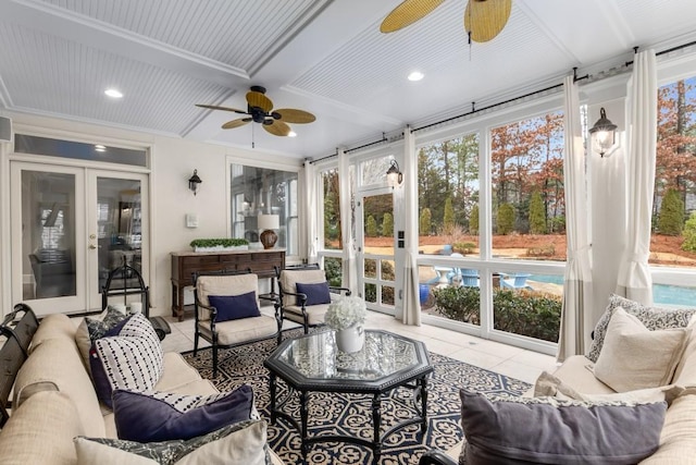 sunroom with plenty of natural light, beamed ceiling, and ceiling fan