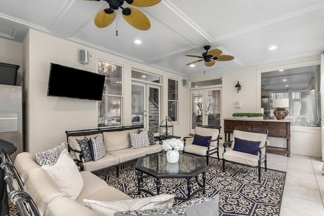 living room with french doors, ceiling fan, beam ceiling, and light tile patterned floors