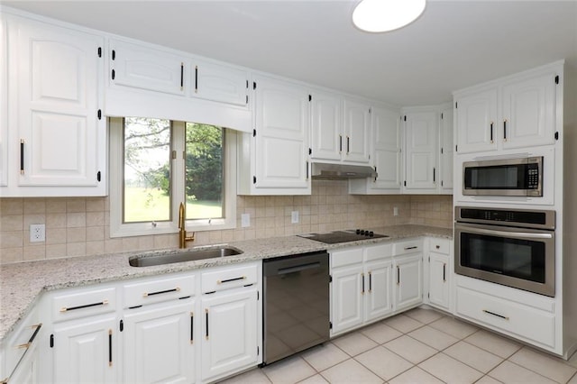 kitchen featuring white cabinets, black appliances, sink, backsplash, and light tile patterned flooring