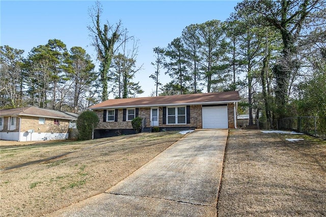 ranch-style house with a garage and a front lawn