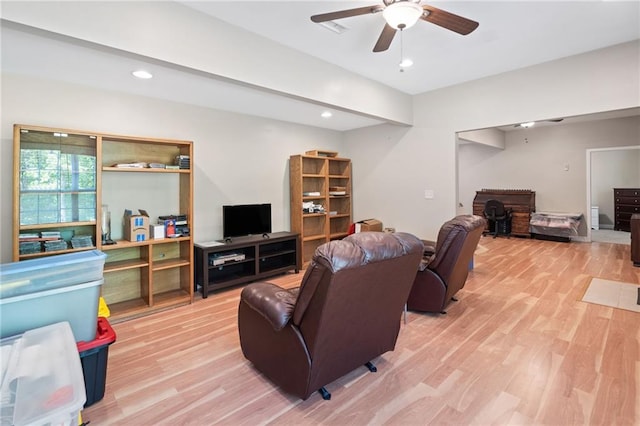 living room with ceiling fan, wood finished floors, and recessed lighting
