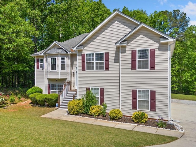 bi-level home with a front yard