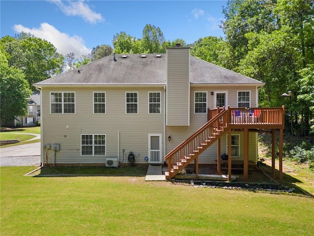 back of property with stairway, a deck, a chimney, a yard, and a cooling unit