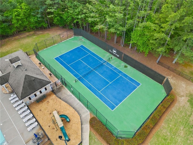 view of tennis court with fence
