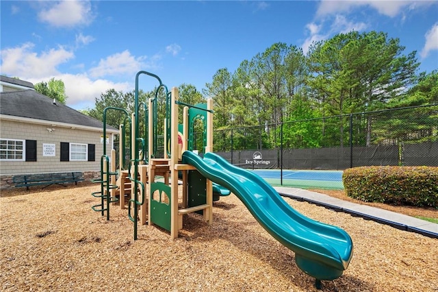 communal playground featuring fence