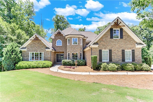 8240 Hurakan Creek Xing, Cumming, GA 30028 - view of front of home featuring stone siding and a front lawn