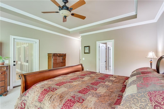 8240 Hurakan Creek Xing, Cumming, GA 30028 - bedroom featuring ornamental molding, light carpet, a tray ceiling, ensuite bath, and a ceiling fan