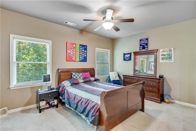 8240 Hurakan Creek Xing, Cumming, GA 30028 - bedroom featuring carpet floors, baseboards, and a ceiling fan