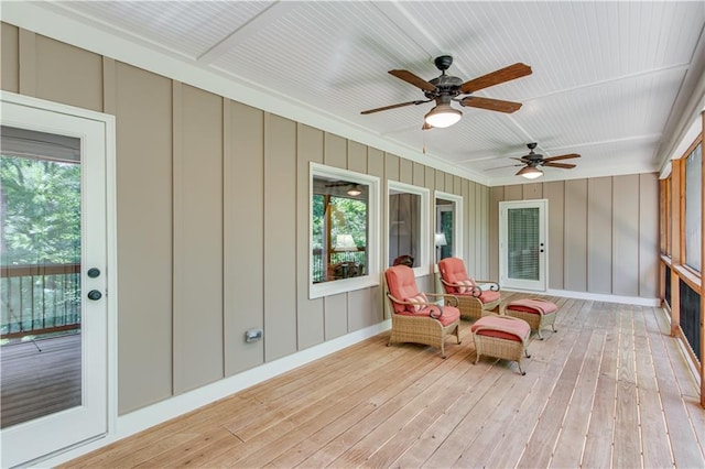 8240 Hurakan Creek Xing, Cumming, GA 30028 - sunroom featuring ceiling fan, healthy amount of natural light, wood-type flooring, and ornamental molding
