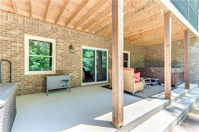 8240 Hurakan Creek Xing, Cumming, GA 30028 - view of patio / terrace featuring a hot tub