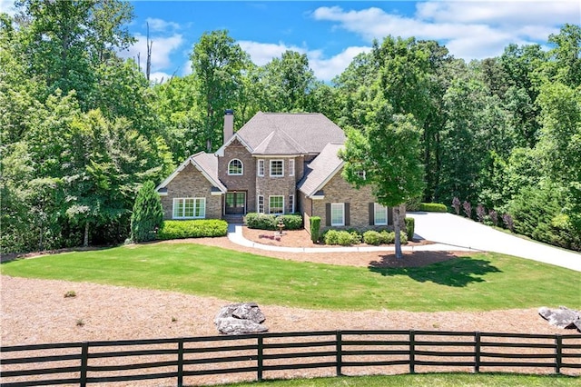 8240 Hurakan Creek Xing, Cumming, GA 30028 - view of front of home with a chimney and stone siding