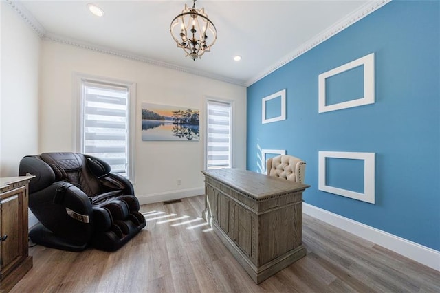 office featuring baseboards, ornamental molding, a chandelier, and wood finished floors