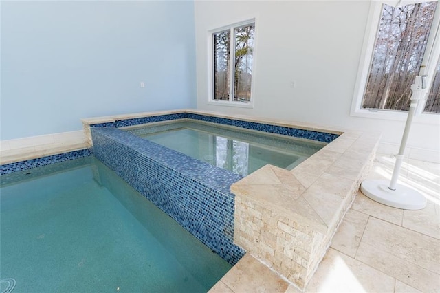 pool with an indoor hot tub