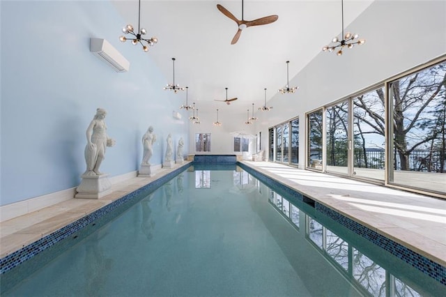 pool with an inviting chandelier and a wall mounted AC