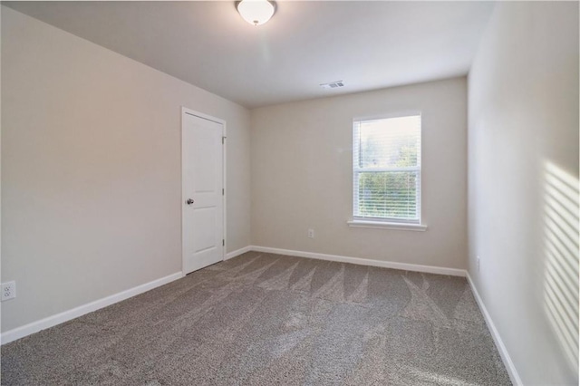 view of carpeted spare room