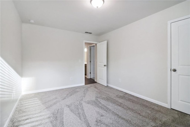 empty room featuring carpet flooring