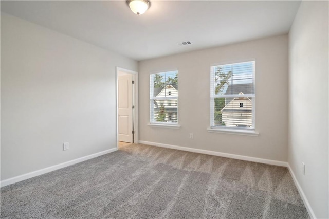 unfurnished room featuring carpet