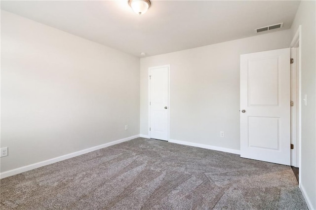 empty room with carpet flooring