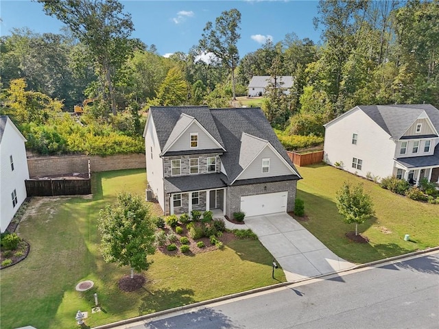 view of front facade featuring a front lawn and a garage