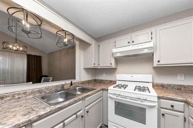 kitchen featuring lofted ceiling, sink, gas range gas stove, white cabinetry, and a notable chandelier