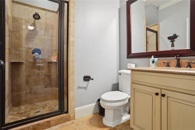 bathroom featuring vanity, crown molding, tile patterned flooring, toilet, and an enclosed shower