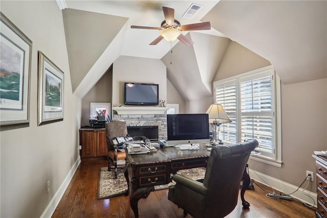 home office with a fireplace, vaulted ceiling, dark hardwood / wood-style floors, and ceiling fan