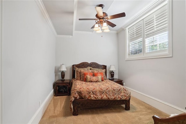 bedroom featuring ceiling fan, ornamental molding, and carpet flooring