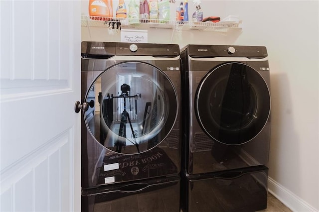 3241 Alhambra Cir, Hampton, GA 30228 - clothes washing area featuring independent washer and dryer, laundry area, and baseboards