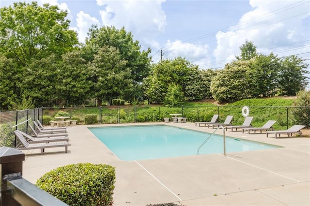 3241 Alhambra Cir, Hampton, GA 30228 - community pool with a patio and fence