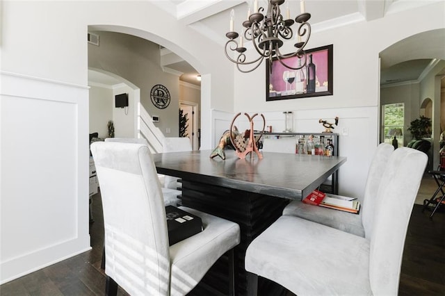 3241 Alhambra Cir, Hampton, GA 30228 - dining space with dark wood-style flooring, a notable chandelier, beam ceiling, ornamental molding, and stairway