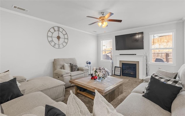 living room featuring crown molding, light colored carpet, and ceiling fan