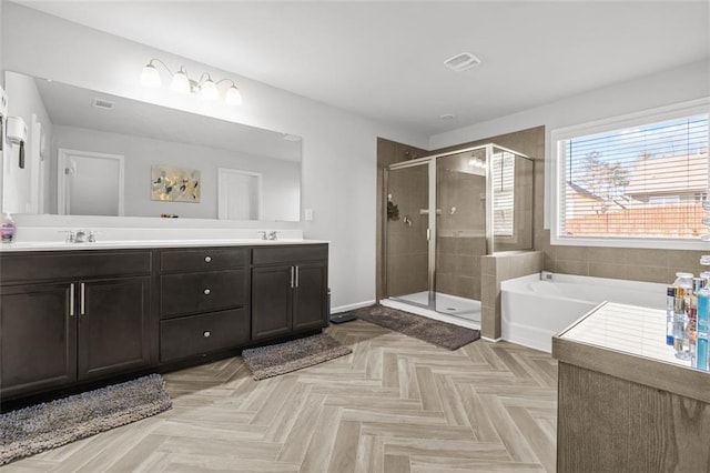 bathroom with vanity, separate shower and tub, and parquet floors