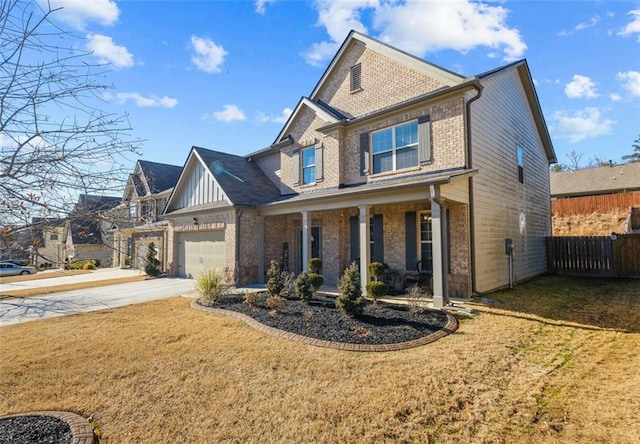 craftsman inspired home featuring a garage, a front lawn, and a porch