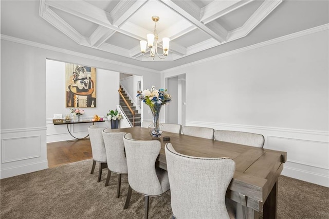 dining area featuring beam ceiling, dark colored carpet, coffered ceiling, and a chandelier